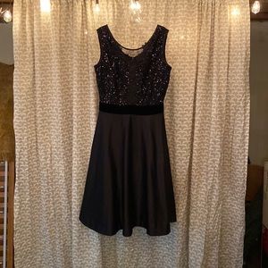 Beautiful black, J.Peterman dress. Sequin details suede band midsection